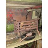 A small wrought and cast iron fire basket of rectangular form 46 cm wide, contents to include a cast