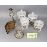 A set of four graduated Italian storage jars for flour, sugar , tea and coffee with painted floral