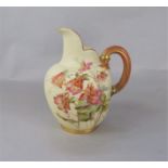 A Royal Worcester flatback jug, with painted and gilded aquilegia decoration and puce printed mark