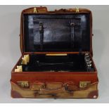A good quality fitted leather travel case with leather lined interior, five silver topped glass