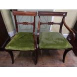 A matched set of six (4+2) Regency and Regency style dining chairs, raised on sabre shaped supports,