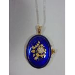 Antique style silver gilt locket with cobalt blue enamel ground and floral seed pearl decoration,