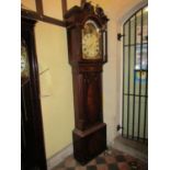 A Regency period mahogany longcase clock, the door with lancet shaped outline flanked by reeded