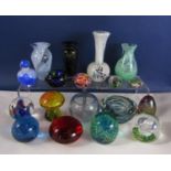 A collection of various glass paperweights including Mdina examples, etc, together with two