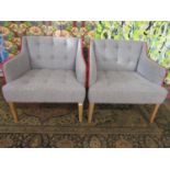 Pair of low back lounge chairs with grey tweed type upholstery and red piping, 71cm high x 73cm wide