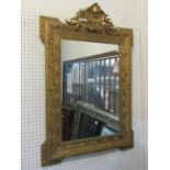 A matched pair of antique gilt framed wall mirrors of rectangular form, the stepped and moulded