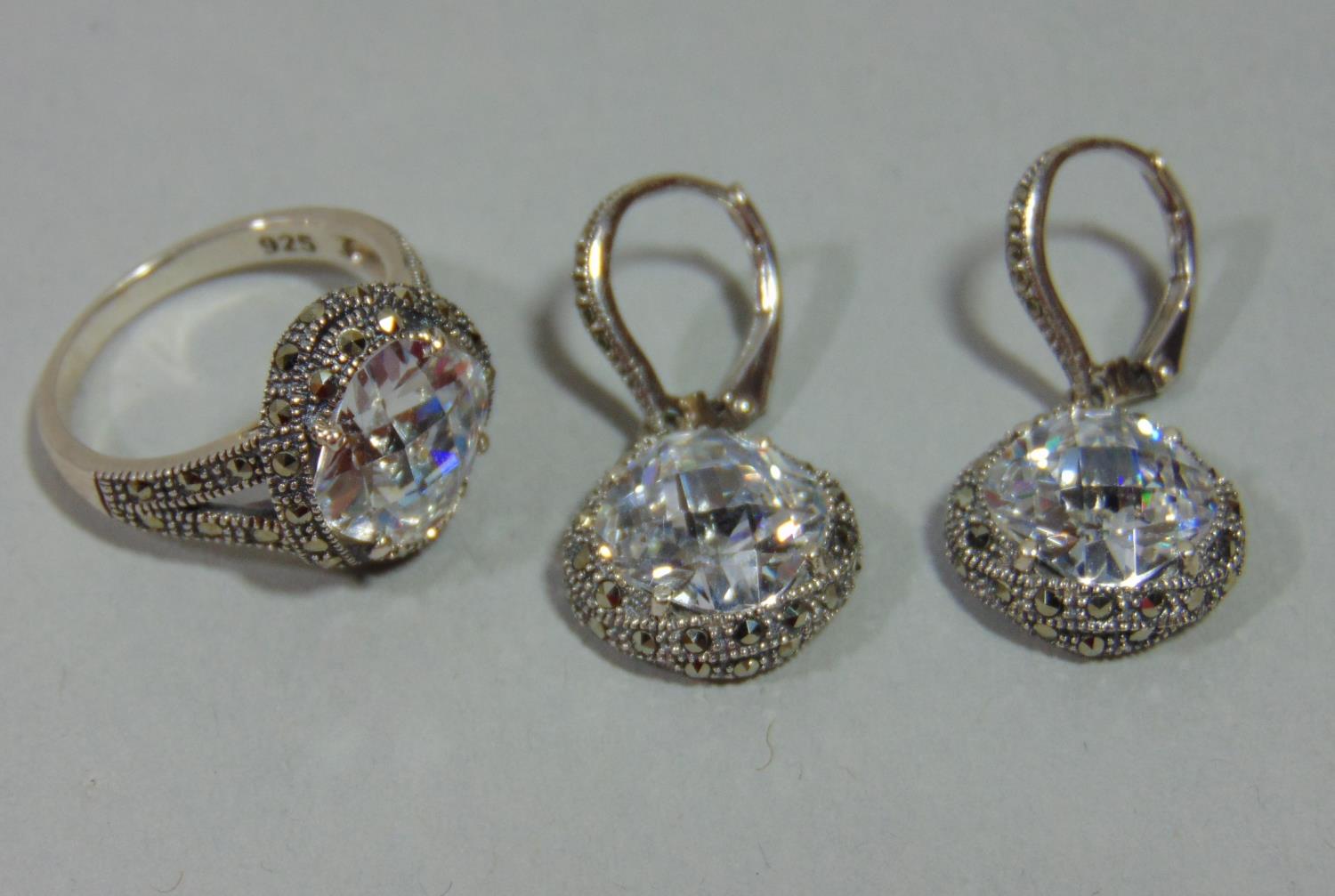 Pair of silver cubic zirconia and marcasite drop earrings and matching ring, size N (3)