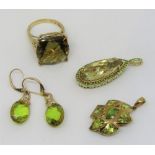 Collection of 9ct dress jewellery set with green gemstones, comprising a ring, a pear cut pendant