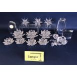 A collection of Swarovski crystal and similar items including a paperweight by Daniel Swarovski, a