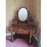 A Victorian figured and burr walnut veneered duchess dressing table with oval mirror plate over an