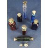 Seven 19th century perfume bottles each with coloured glass bodies, blue, red and green, all with