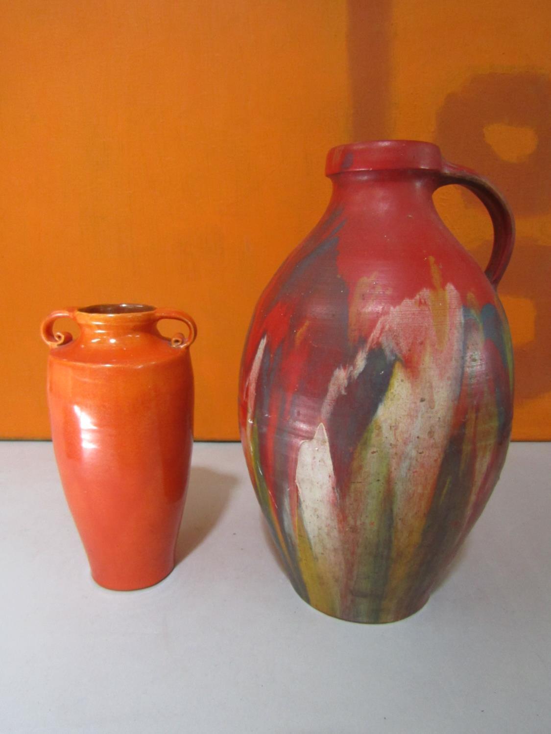 Brannam of Barnstaple pottery - Studio pottery water carrying jug, with red lava type glaze with