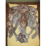 A heavy lead rams head and infilled rams head wall mask, 37 cm high x 30 cm wide
