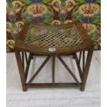 Arts and crafts thebes type stool, the curved top with strung seat upon a latice open framework 39cm