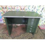 Vintage industrial green painted steel tanker desk, with a rubber top and single pedestal of seven