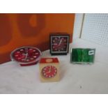 A collection of retro alarm clocks to include a Rhythm four jewel transition bell clock with day