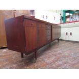 Unusual mahogany Danish style sideboard fitted with three drawers, fall front door and two
