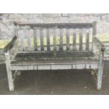 A weathered teak two seat garden bench with slatted seat and back (AF), 120 cm long