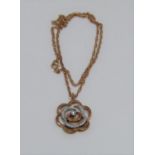 9ct diamond set pendant necklace in the form of a rose, 7.1g