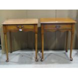 A pair of Georgian style side tables, rectangular, each enclosing a frieze drawer raised on four pad