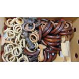 A large quantity of turned timber curtain rings of various sizes