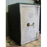 A "Sentry Safe" with later painted front approx 50 cm square x 76 cm in height (key in office0