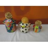 Mary Rose Young Studio lidded pots, the largest decorated with roses, the others with polka dots and