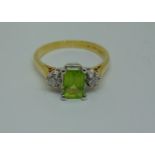 18ct three stone peridot and diamond ring, size O, 3.8g