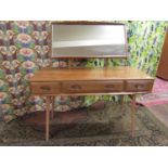Unusual good quality Ercol light elm dressing chest, the raised mirror back over a base fitted