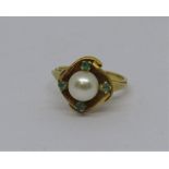 Yellow metal pearl and green gem ring, indistinct marks to outer shank, size I, 4.9g