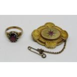 9ct claw set garnet ring, size N and an antique 15ct brooch set with a pink ruby, 13.7g total (2)