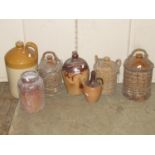 A small collection of stoneware jars and flagons to include a 19th century salt glazed example