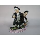 A 19th century pottery figure group of the Vicar and Moses/or the Drunken Vicar,possibly of Scottish