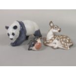 Three Royal Copenhagen models of animals comprising a panda no 298, a recumbent fawn no 2609, a