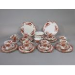 A collection of Edwardian Paragon china tea wares of wrythen form, comprising milk jug, slop bowl,