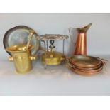 A box of various metal wares to include brass gas stove, a copper frying pan, a pestle and mortar, a