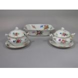 A pair of mid-19th century two handled sauce tureens, covers and stands, with painted floral