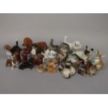 A collection of Beswick ceramic cats, dogs and other animals including Siamese cat 1559, two Siamese