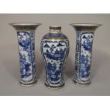 A 19th century Chinese garniture of vases comprising a shouldered vase 26 cm tall approx and a