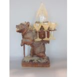 Good quality carved Black Forest bear decanter set, the bear stood on his hind legs holding a