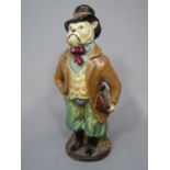 An unusual early 20th century pottery figure of standing bull dog dressed as an English gentleman