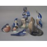 A collection of Royal Copenhagen figures including a fisher boy whittling number 905, 19cm approx, a