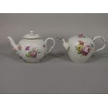 An 18th century teapot of globular form with polychrome painted floral sprigs and sprays and with
