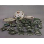 A quantity of Wedgwood green ground jasper wares comprising a pair of low candlesticks, bowl and