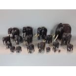A group of ebony elephants of graduated form, the largest 16cm high (17)