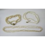 Three baroque pearl necklaces to include an example with 14k diamond set clasp (clasp of other