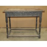 A Victorian oak side/centre table of rectangular form with carved foliate border and frieze drawer