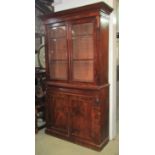 A Victorian mahogany chiffonier bookcase, with projecting moulded cornice over a pair of glazed