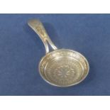 Good Georgian silver 'frying pan' caddy spoon, the bowl embossed with a star and various other