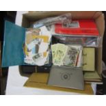 A book containing a large quantity of unsorted British and worldwide stamps in various boxes,